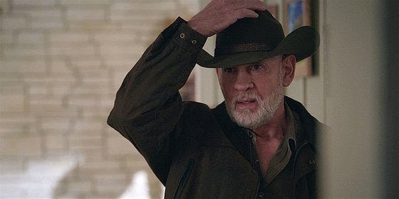 Walker Bonham touching his black cowboy hat. Walker Bonham touching his black cowboy hat.