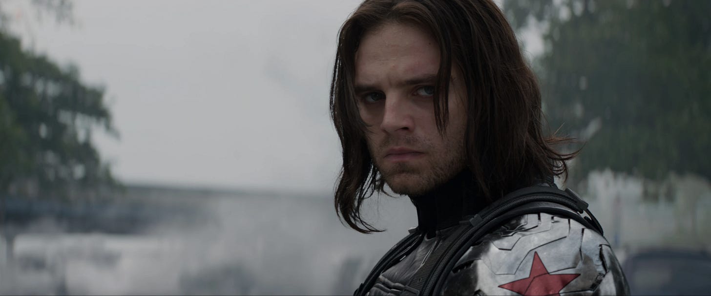 Bucky looking all brooding with his long hair and metal arm
