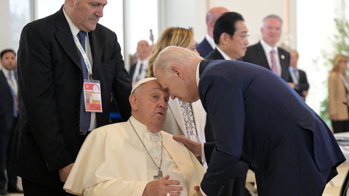 Pope Francis greets US President Joe Biden before a working session on Artificial Intelligence (AI), Energy, Africa-Mediterranean at the Borgo Egnazia resort during the G7 Summit in Savelletri near Bari, Italy, on June 14, 2024.