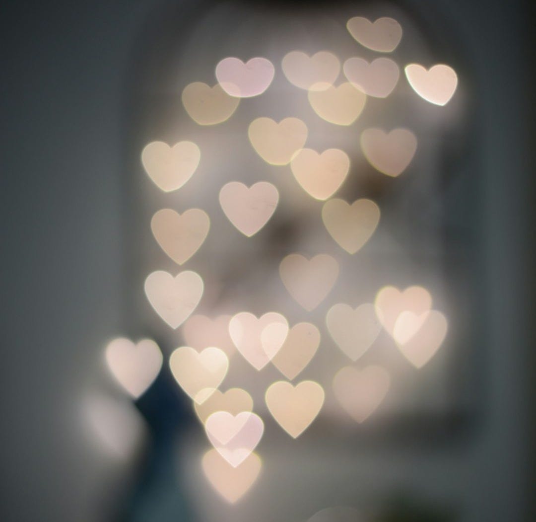 multiple blurry heart shaped lights multiple blurry heart shaped lights