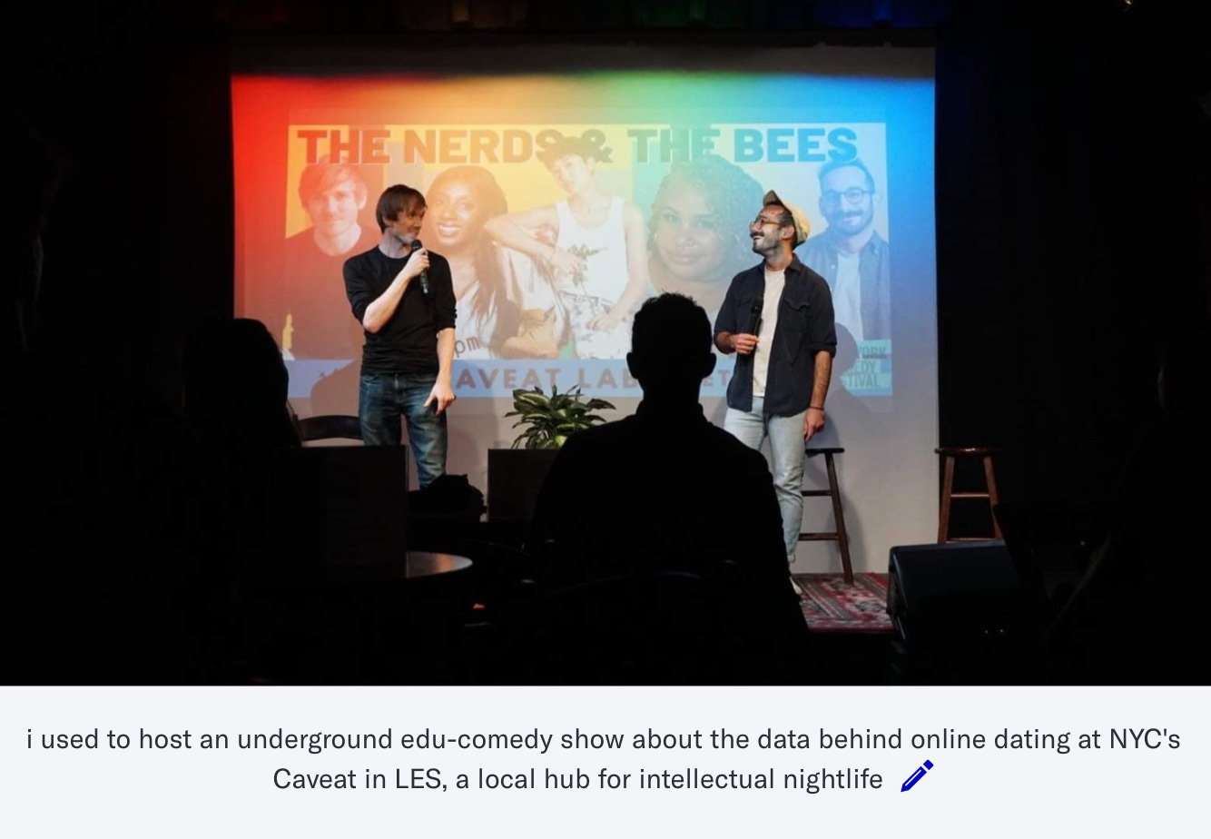 screenshot of a captioned photo of dating consultant steve dean in which he stands on stage holding a microphone