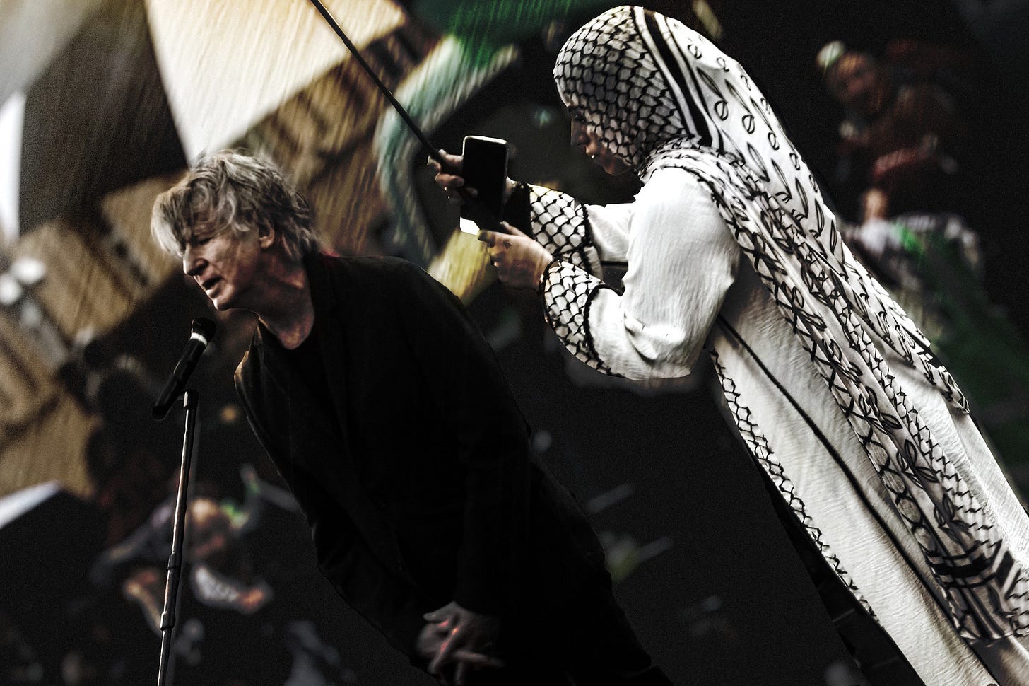 May be an image of 2 people and crowd