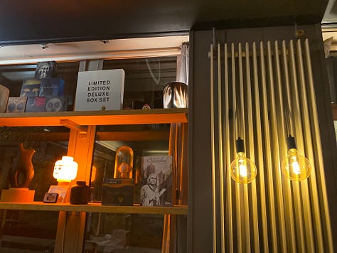 A restaurant with people, wine, music and a bar