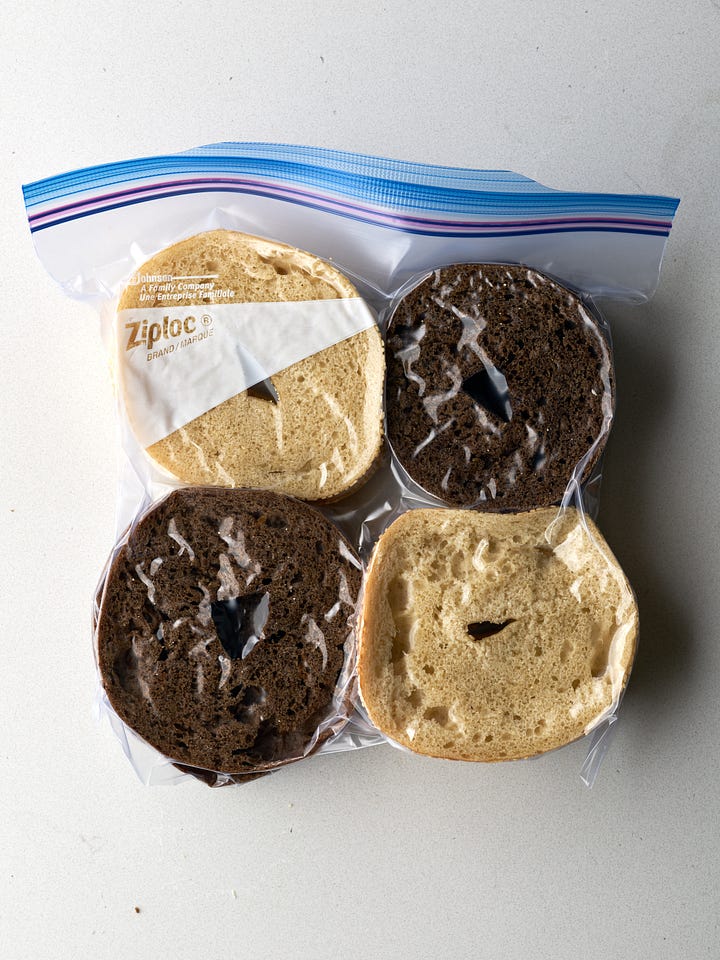 A tower of bagel slices in a freezer bag next to side by side bagel slices in a zipper bag.