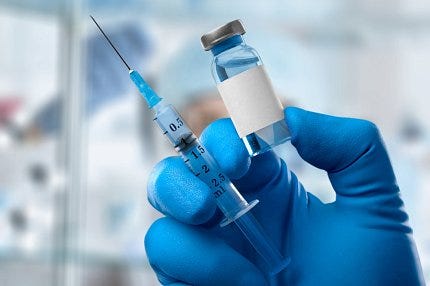 A needle and a vial 