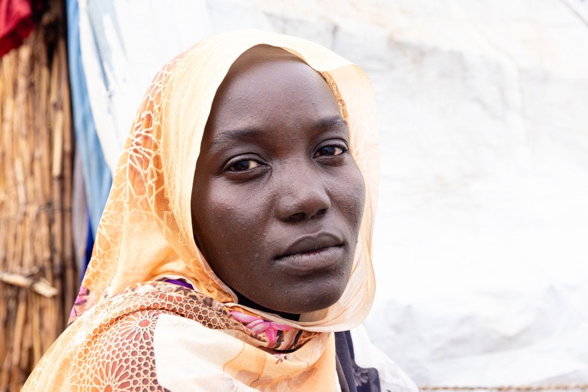 Someya was a henna artist in Western Darfur. After her father was killed in a mosque, she crossed the border to Chad on foot with her three small children. She was pregnant at the time.