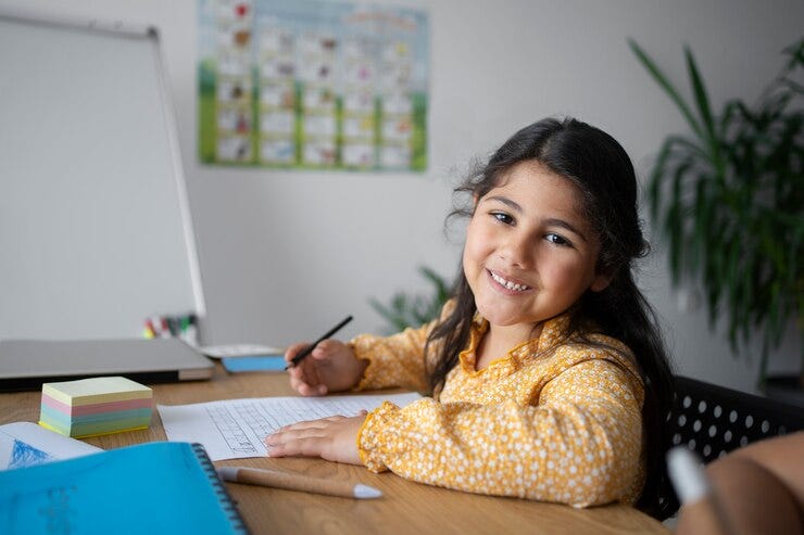 Medium shot smiley girl learning english