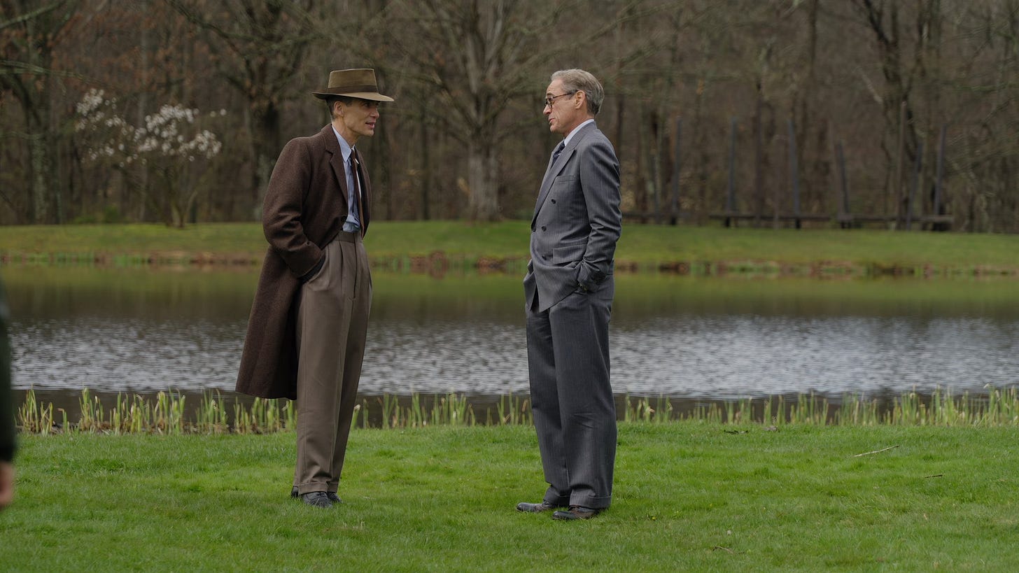 Dr. Oppenheimer and Lewis Strauss, deep in conversation
