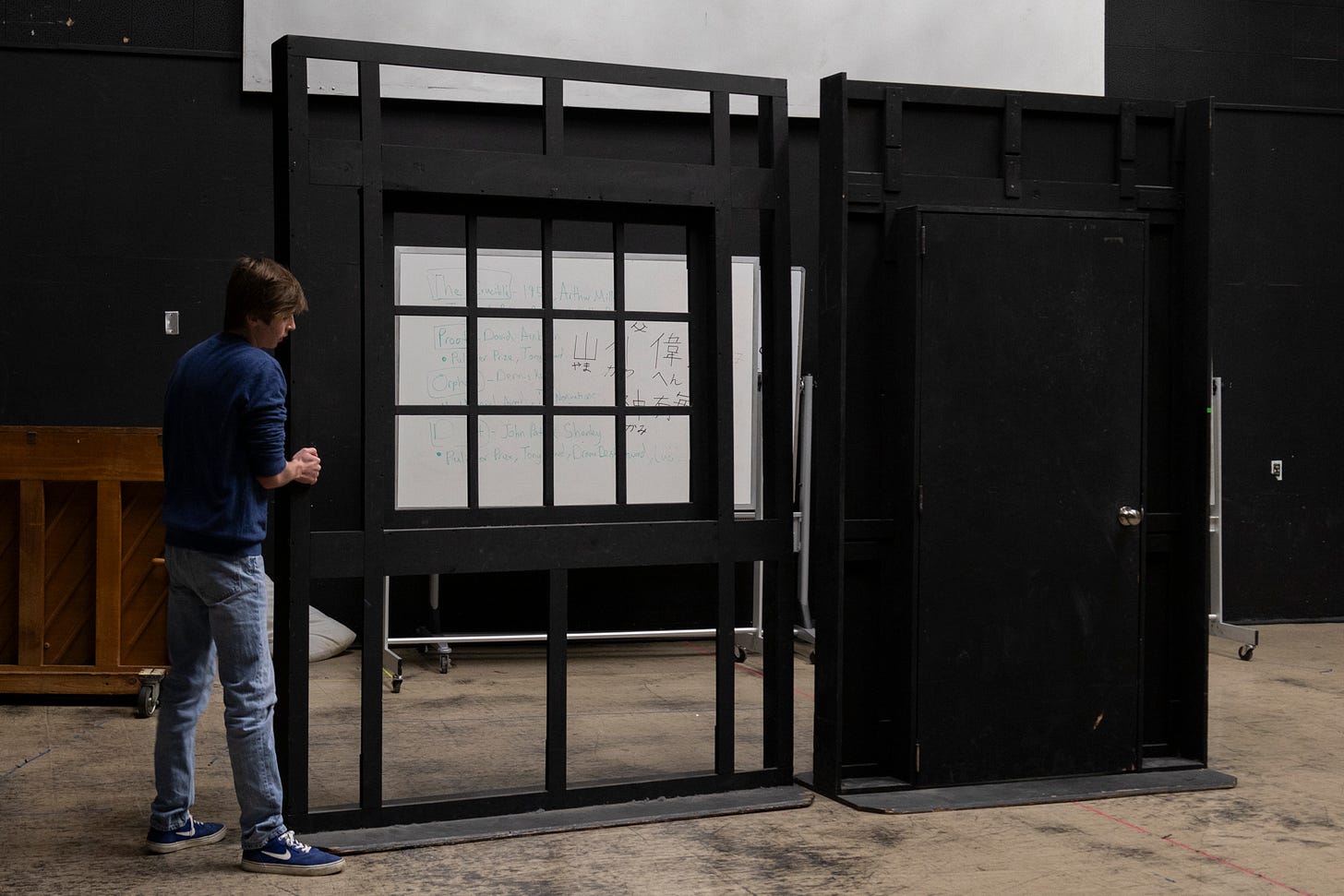 El Camino College theatre major Jackson Yollin, 19, sets up staging for a house and front porch for a dramatic scene at 2 p.m. Tuesday, April 8. (Kaitlyn Gochez | The Union)