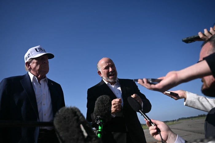 President Trump and Secretary of Commerce Howard Lutnick speaking to reporters.