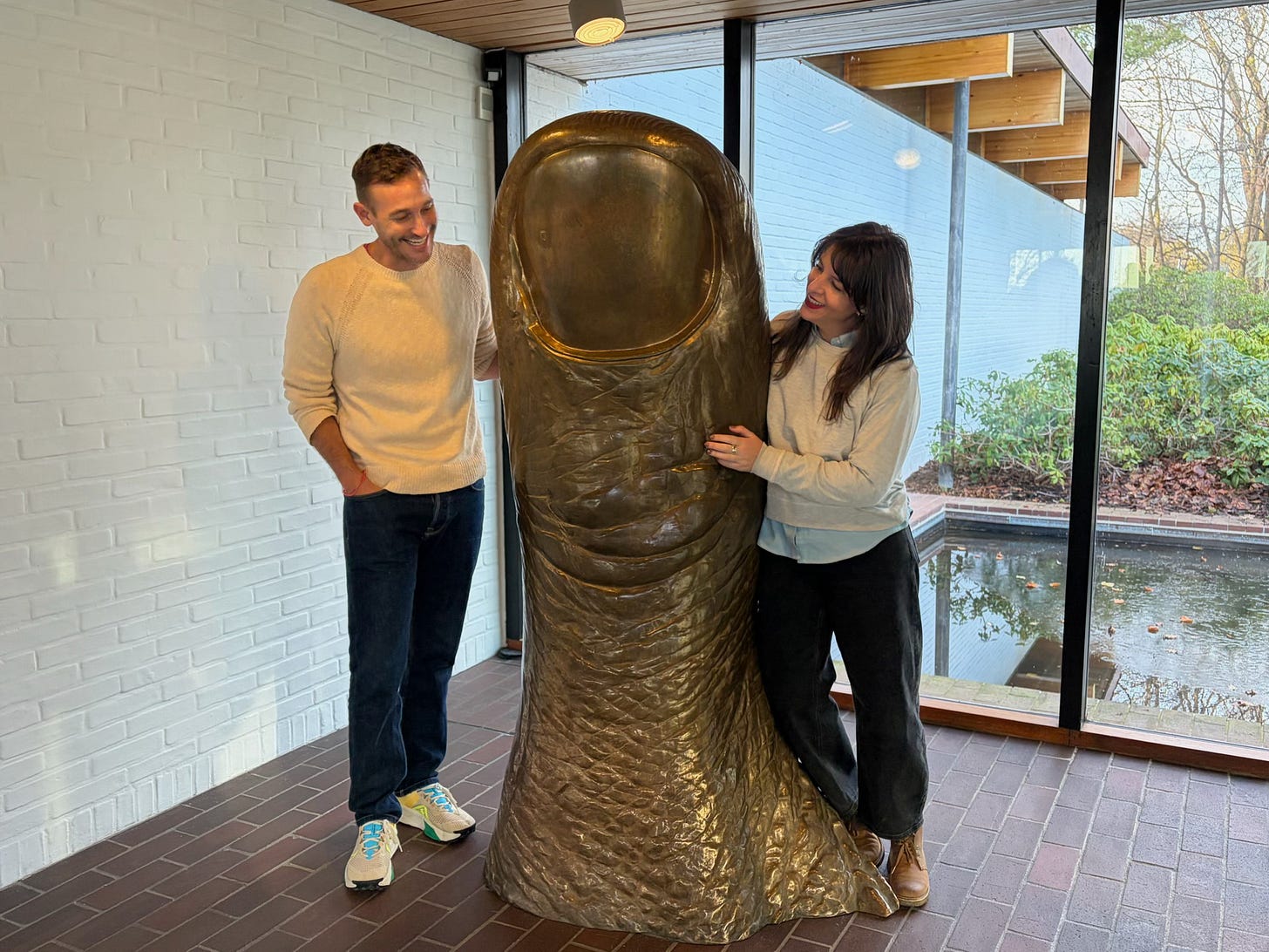 Megan Falley and director Ryan White smile beside a bronzed sculpture of a thumb Megan Falley and director Ryan White smile beside a bronzed sculpture of a thumb