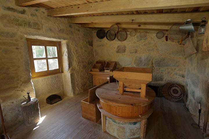 Vila de Punhe, Portugal - April 7, 2025: Historic Moinho do Inácio water mill with apotropaic symbols and scenic riverside leisure area This 1837-restored mill is a cultural landmark, offering visitors a glimpse into Portugal’s traditional milling heritage and a serene natural retreat.