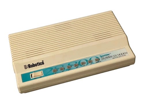 Beige US ROBOTICS 28,800 V.32 bis SPORTSTER NO POWER ADAPTER with green panel and blue text on front.