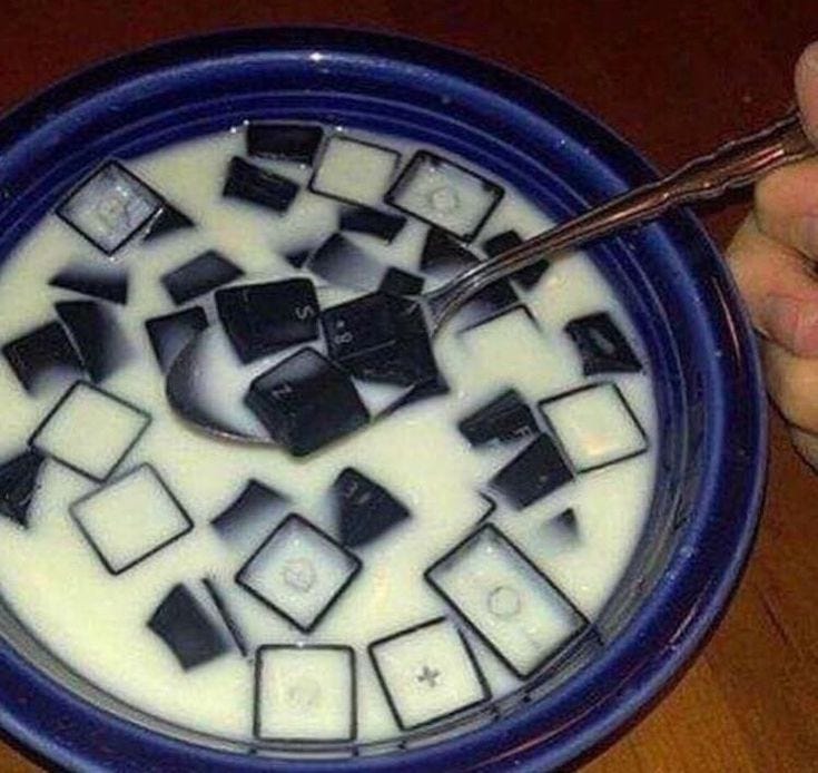 This may contain: a blue bowl filled with white and black squares This may contain: a blue bowl filled with white and black squares