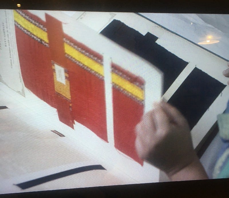 Photo of Raisa Kabir’s film ‘Resistances’ as she flicks through the ‘Textile Manufactures of India’. Photo of Raisa Kabir’s film ‘Resistances’ as she flicks through the ‘Textile Manufactures of India’.
