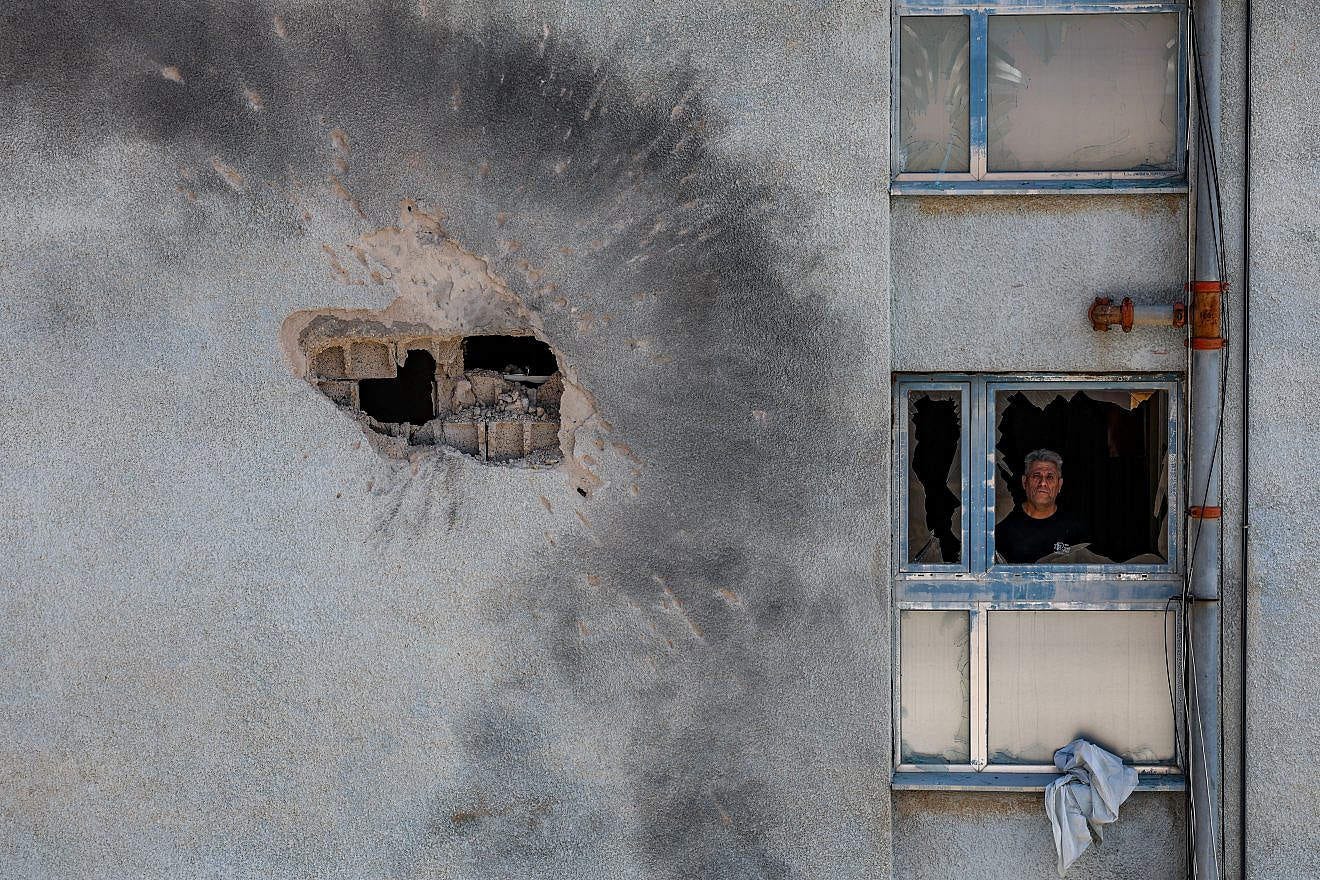 The damage after a rocket fired from Lebanon hit a building in the northern Israeli town of Kiryat Shmona, Feb. 11, 2024. Photo by David Cohen/Flash90. The damage after a rocket fired from Lebanon hit a building in the northern Israeli town of Kiryat Shmona, Feb. 11, 2024. Photo by David Cohen/Flash90.