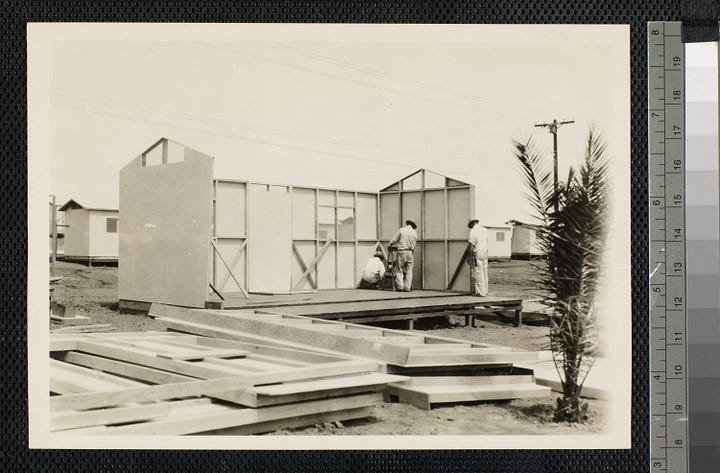 One shows a foundation with completed cabins in the background, another shows a frame without a roof, and no furniture. The third image is a completed house with porch viewed from the front, and the last is a furnished cabin with no roof to show the interior layout