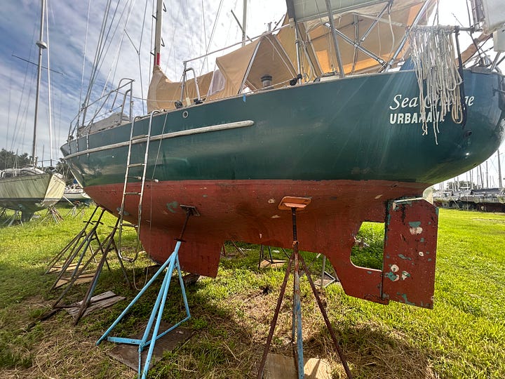 Pacific Seacraft sailboat on lift and stands. Pacific Seacraft interior organization.