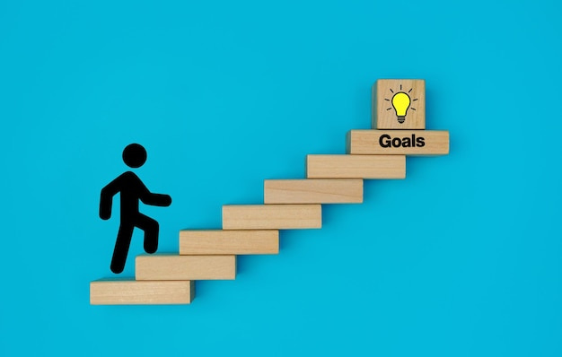 Premium Photo | Stickman climbing stairs made by wooden blocks with the  target icon at the top goals concept achi