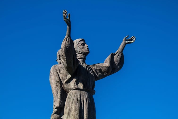 A statue of a man, a woman and two children commemorating Ukraine's 1930s famine. A statue of a man, a woman and two children commemorating Ukraine's 1930s famine.