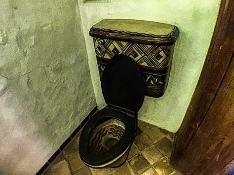 a ceramic toilet, sink, and shower