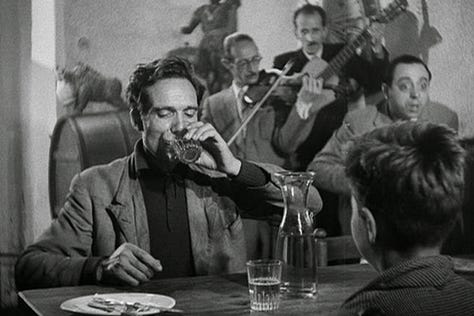 A father and son have a garlic bread dinner in The Bicycle Thief (Ladri di Bicilette or The Bicycle Thieves) (1948) | Film Flavor: A Newsletter Surveying Food in Film