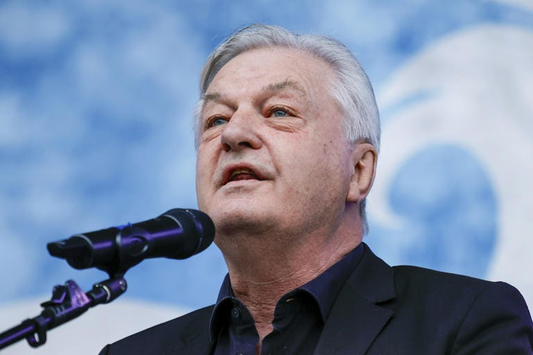 FILE - Juergen Elsaesser, founder and editor-in-chief of the magazine Compact, speaks during a rally of the far right magazine 'Compact' at the train station in Velten, Germany, on March 30, 2024. A German federal court on Wednesday suspended a ban the government imposed last month on Compact magazine. (Carsten Koall/dpa via AP, File)