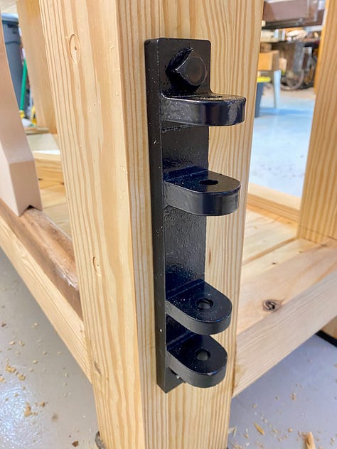 A lag bold, mounting blacket and the swing-away seat.