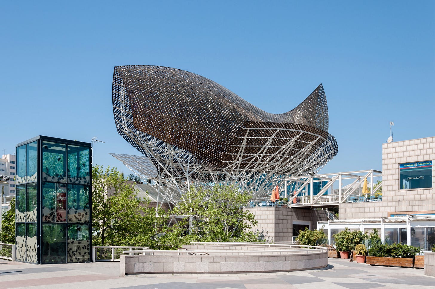 Photograph of Frank Gehry's "Golden Fish," 1992 Barcelona Olympics, for the Poetry in America Substack Along These Lines