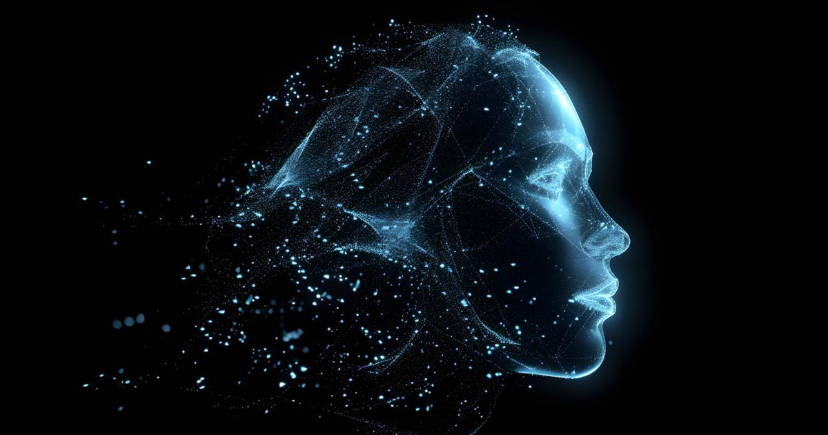 Digital rendering of a human face made of glowing blue particles and threads, dissolving into space — suggesting artificial intelligence, connection, and fragmentation. Digital rendering of a human face made of glowing blue particles and threads, dissolving into space — suggesting artificial intelligence, connection, and fragmentation.