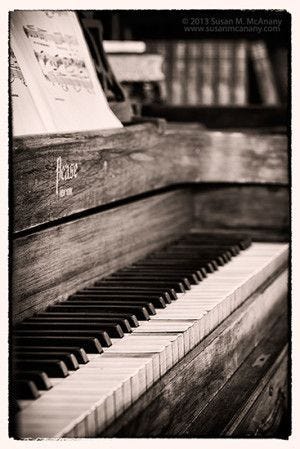 This may contain: an old piano is shown in black and white This may contain: an old piano is shown in black and white