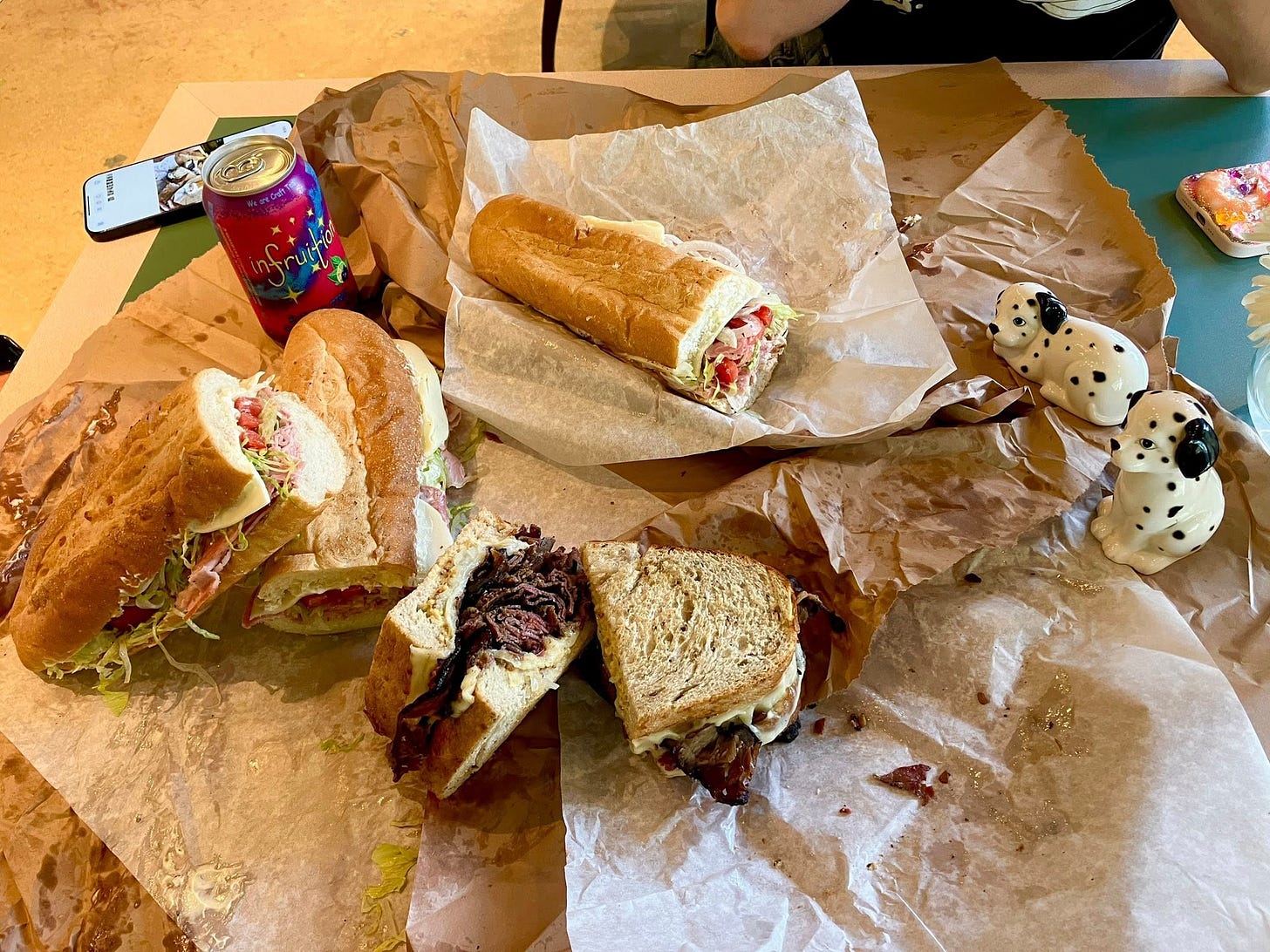 May be an image of club sandwich, baguette, chicken sandwich and sub sandwich