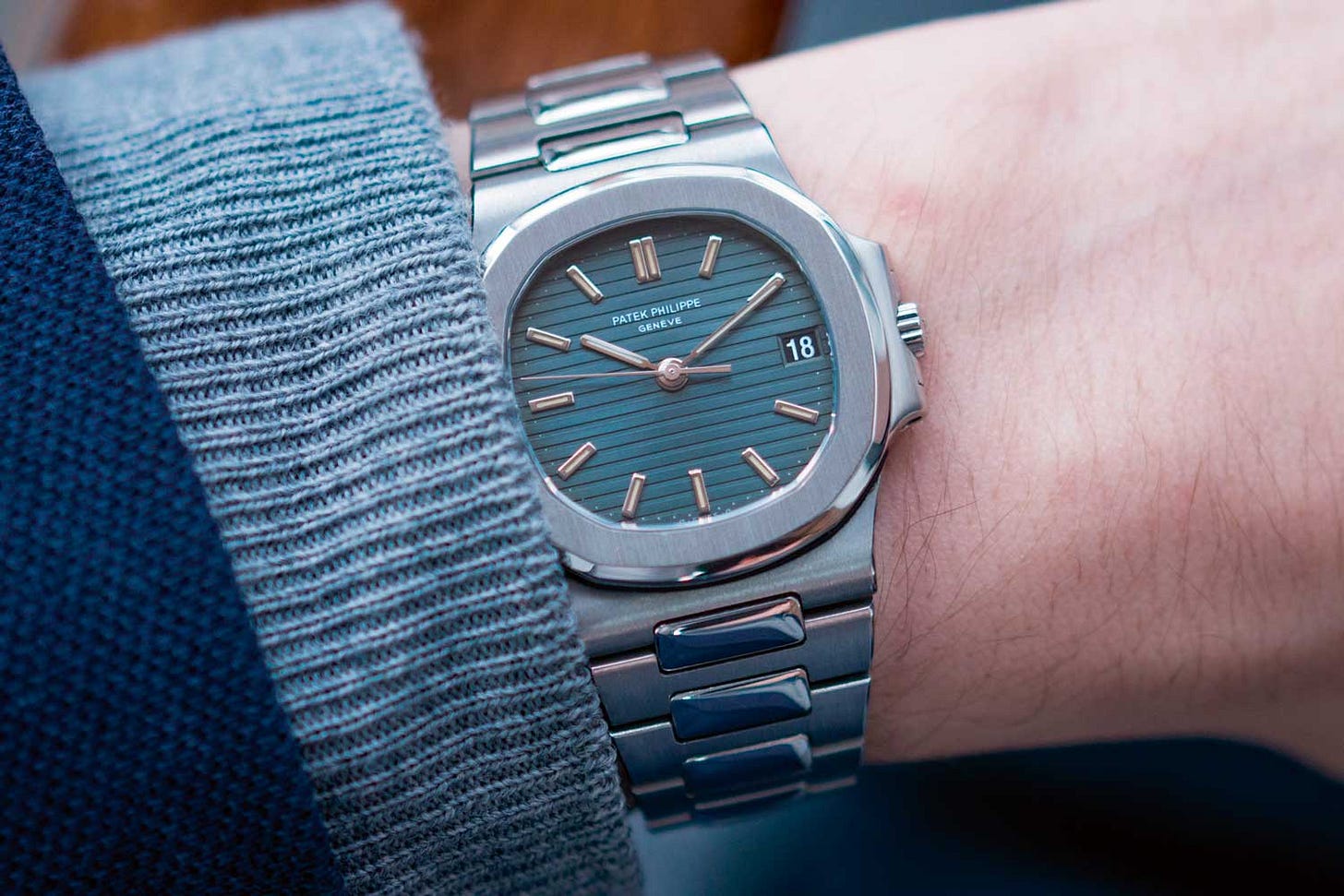 Patek Philippe Nautilus watch worn on the wrist.