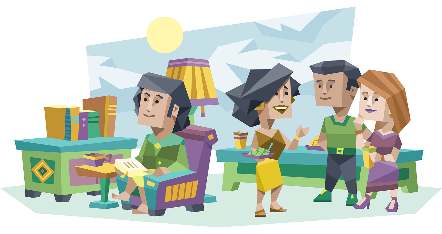 A person sits reading in a comfortable chair while three other people chat together in the background, illustrating different ways people can enjoy time alone and with others.