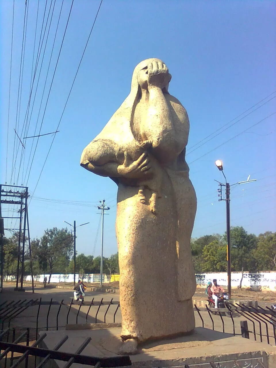 A statue of a person holding a baby

AI-generated content may be incorrect.