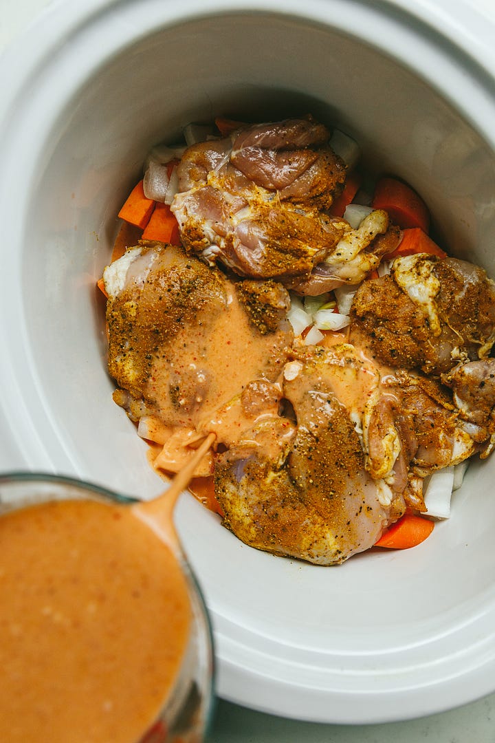Thai red curry in the crockpot and on a serving plate.