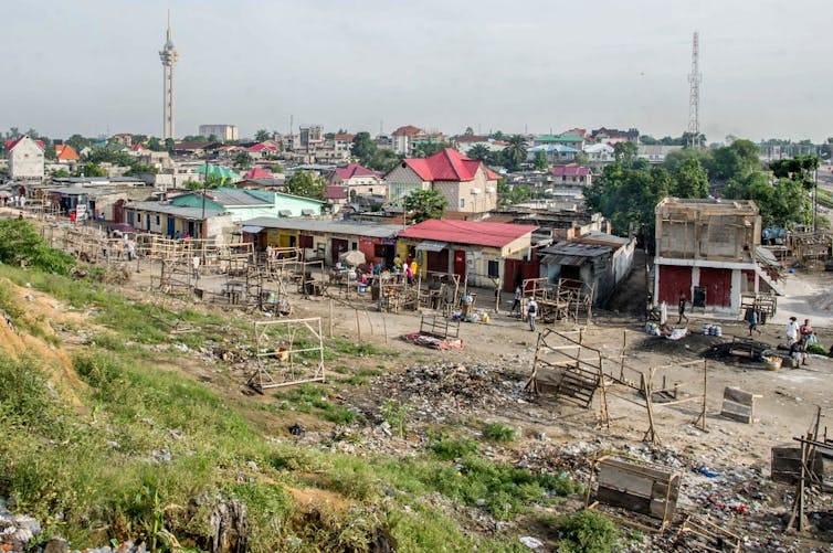 A view of a city with rundown shops at the outskirts. A view of a city with rundown shops at the outskirts.