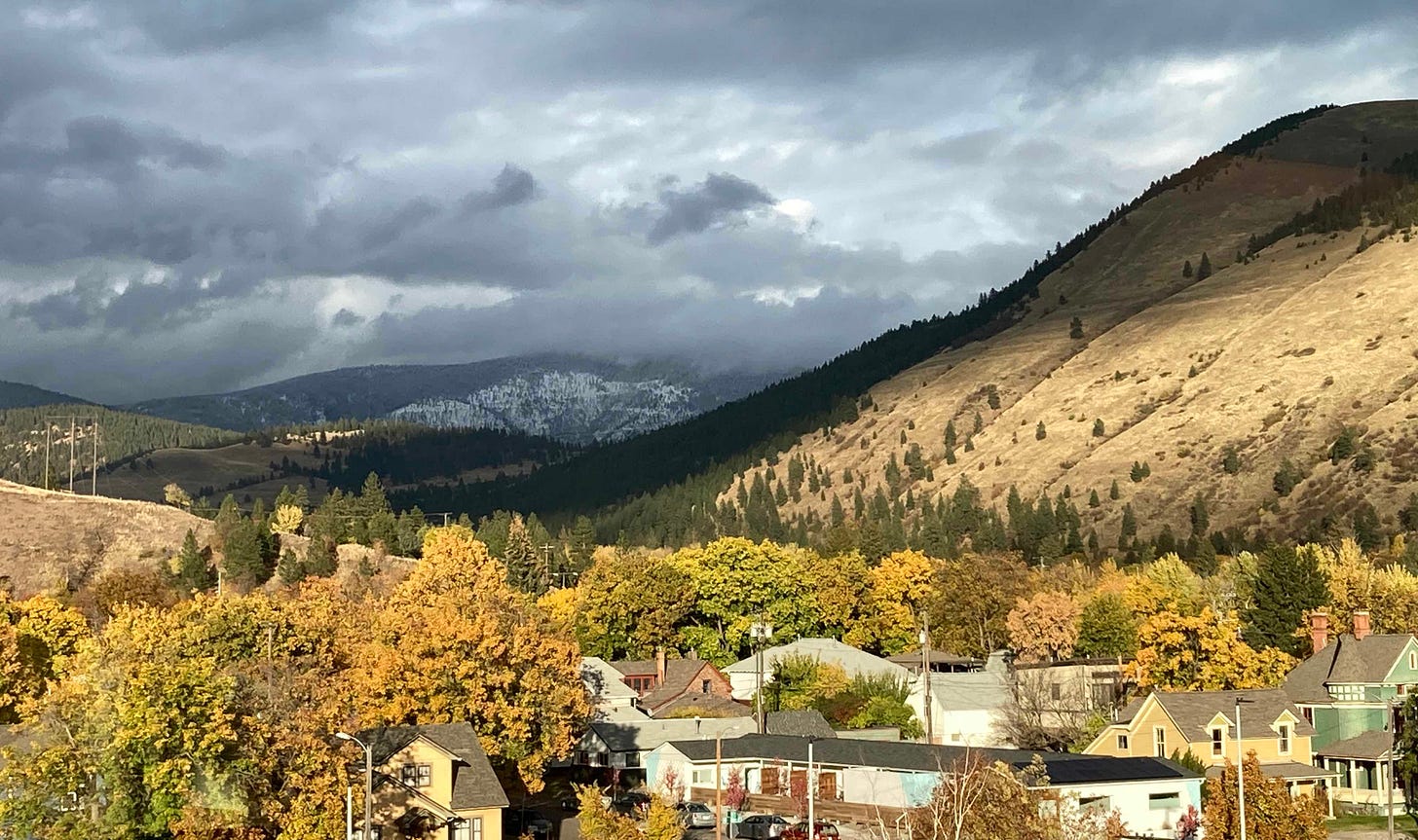 missoula hills at sunset, with snow in background
