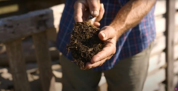 Compost in the hands of Charles Compost in the hands of Charles