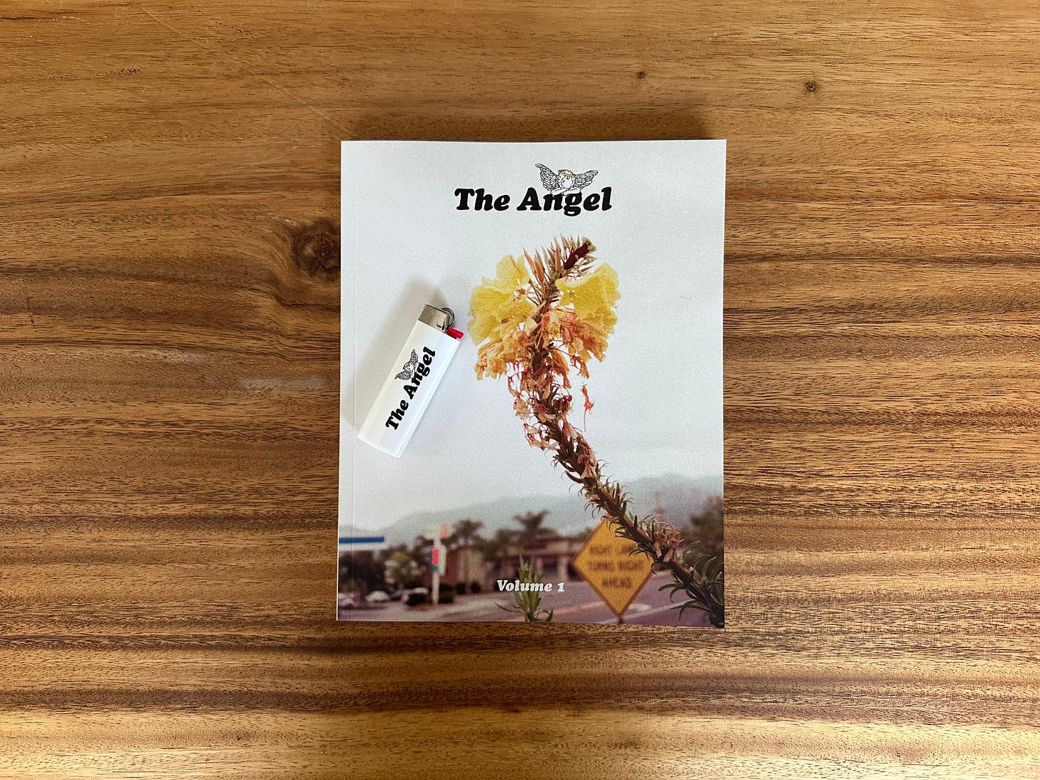 The Angel: Volume One and a matching lighter