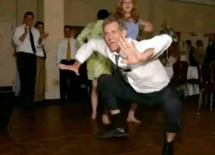 This may contain: a man and woman are dancing on the dance floor