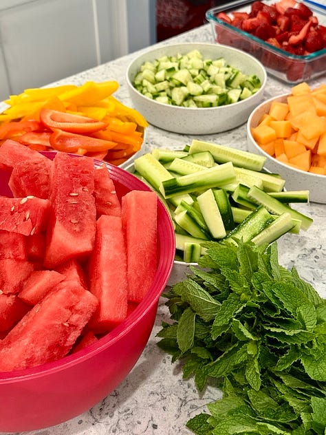 fresh strawberries; hydrating electrolytes water, fresh watermelon and cucumbers