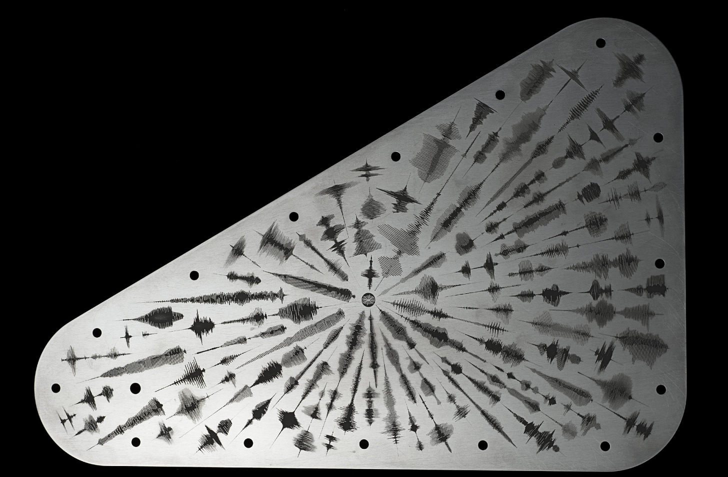 A triangular metal plate containing 2.6 million names submitted by the public, plus recordings of the word “water” spoken in 103 languages.