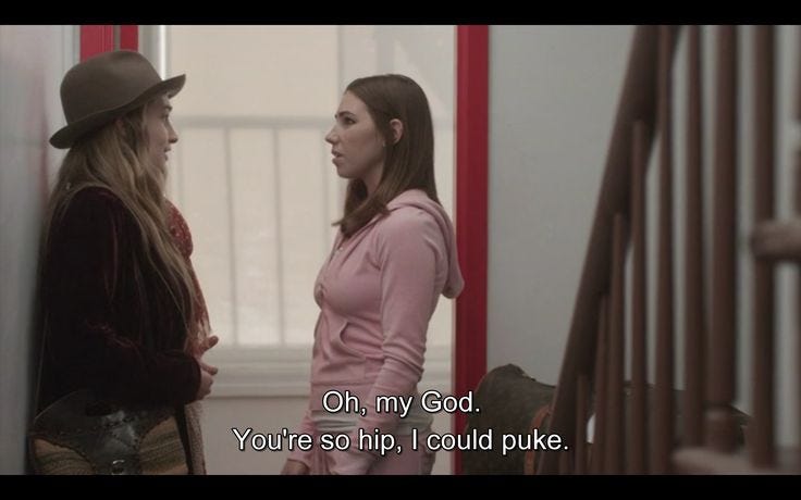 This may contain: two young women standing next to each other in a hallway with the words on my god you're so hip i could puke