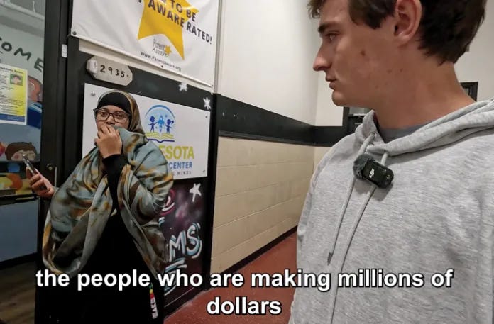 A captioned screenshot from a post by YouTuber Nick Shirley, right, as he visits one of several Somail-American-run daycare centers in Minnesota that he claims provided no care for children while pocketing large government payouts. (Nick Shirley/YouTube)