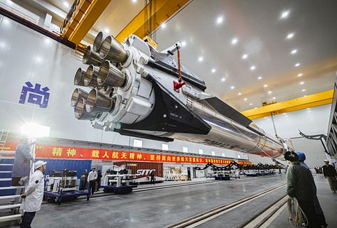 LandSpace's Zhuque-3 Y1 vehicle heading to the launch pad and recieving its payload fairing.