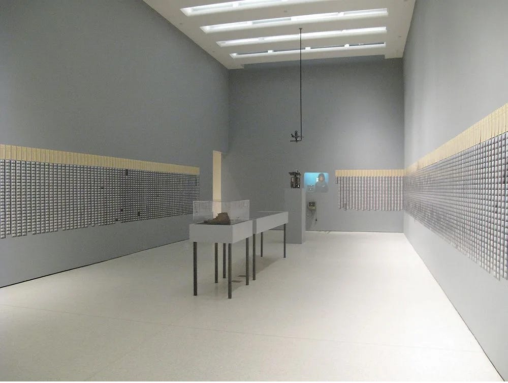 Photo of time cards systematically pinned around a room