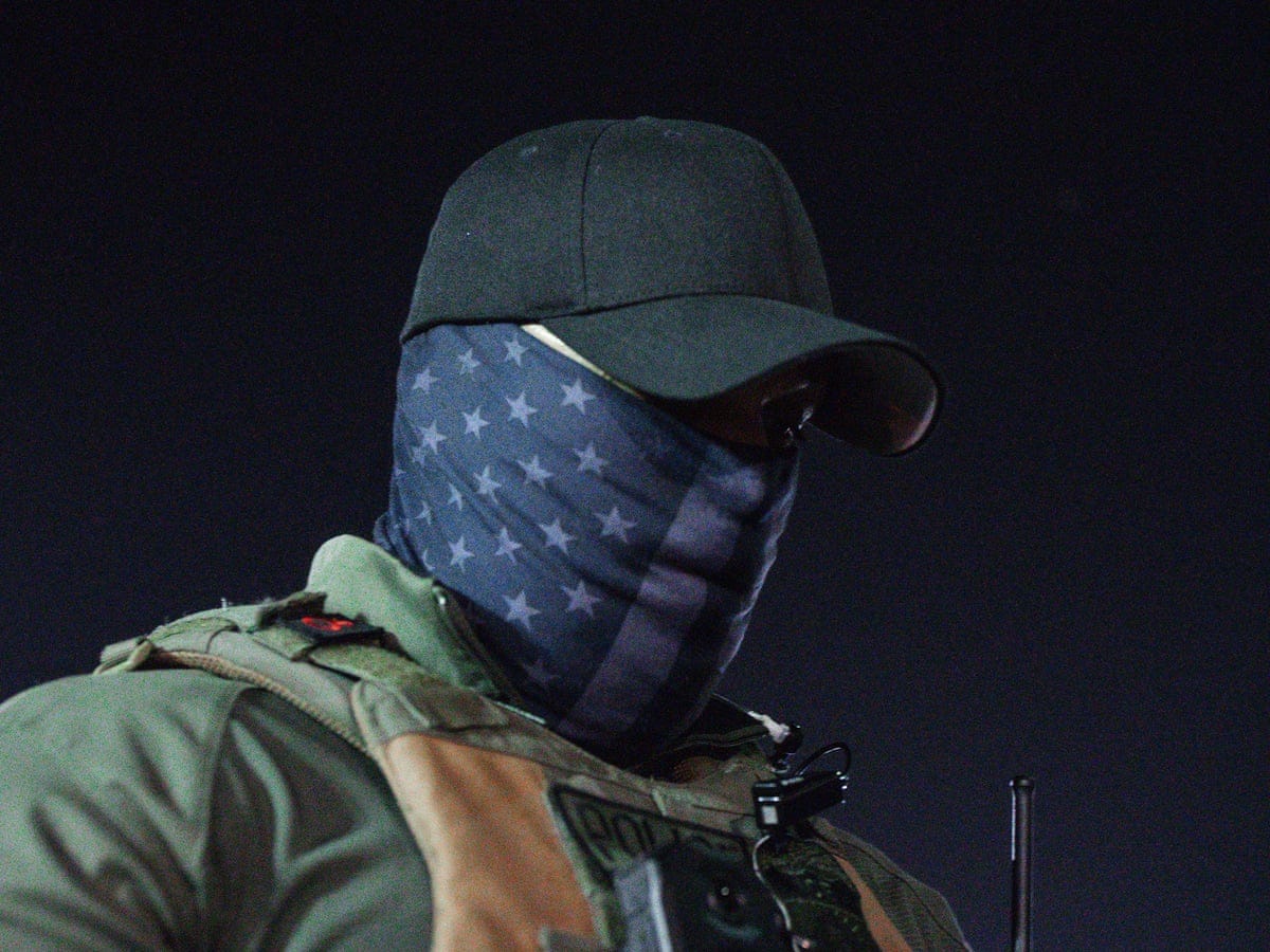 The alarming rise of US officers hiding behind masks: 'A police state' | US  policing | The Guardian