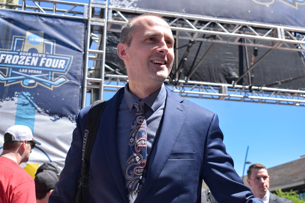 Todd Knott smiles while looking up