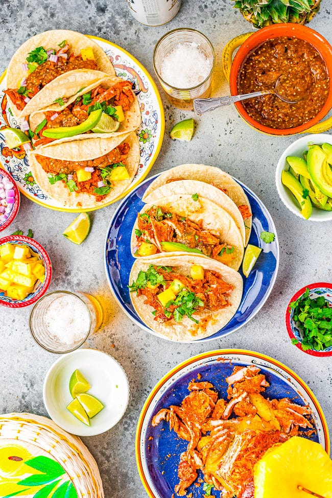 Overhead view of tacos al pastor with toppings